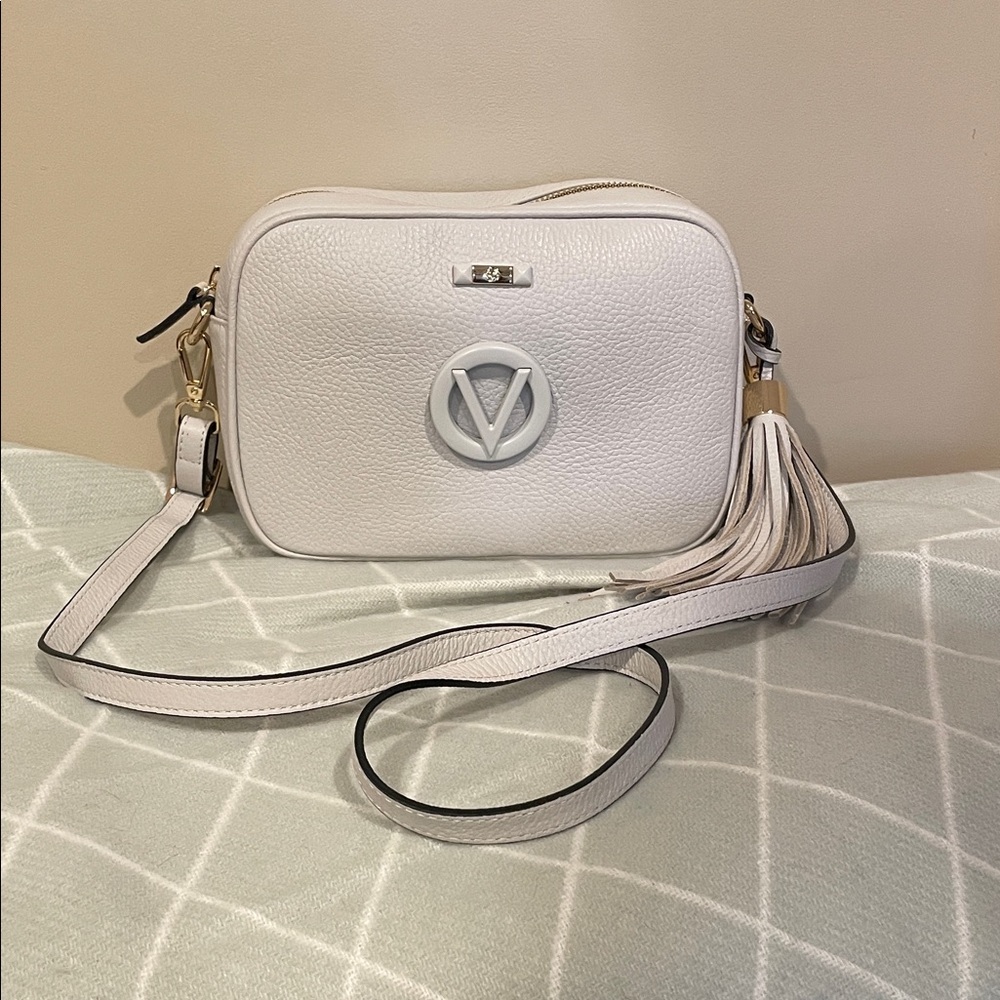 Mario by Valentino Pebble Leather Crossbody with Tassel grey ish color.